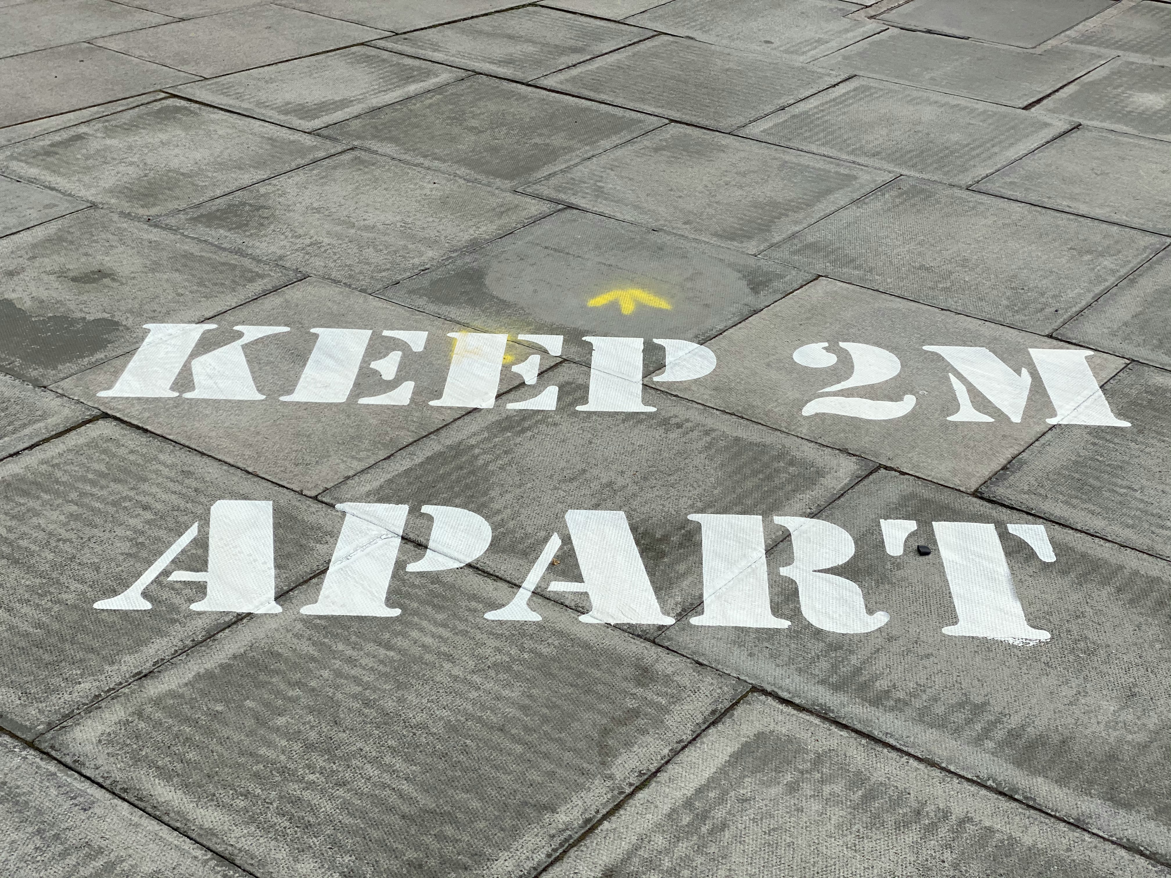 white and black love print on gray concrete pavement